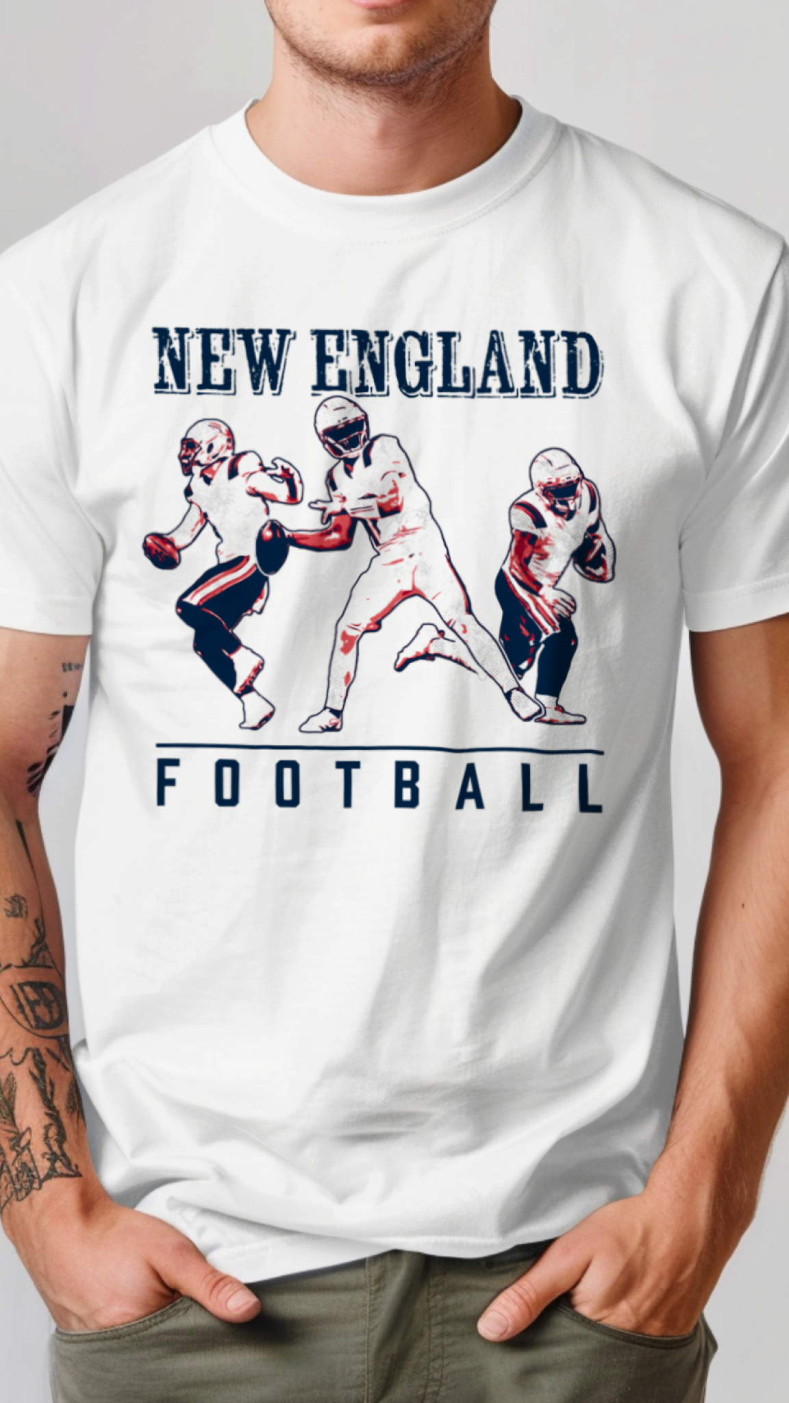 White t-shirt with New England football graphic and text on a plain background