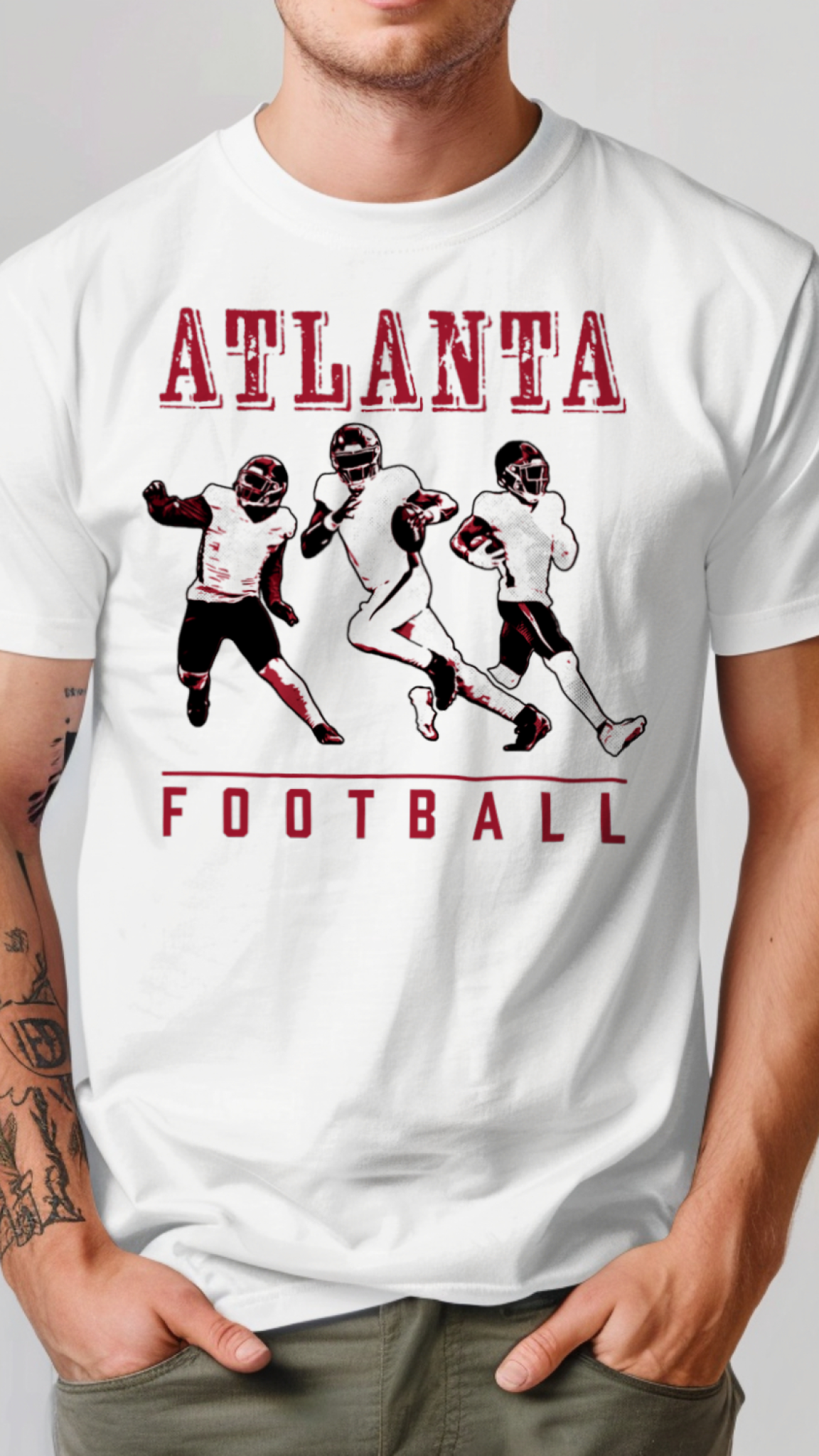 White t-shirt with red 'Atlanta Football' design featuring football players on a gray background