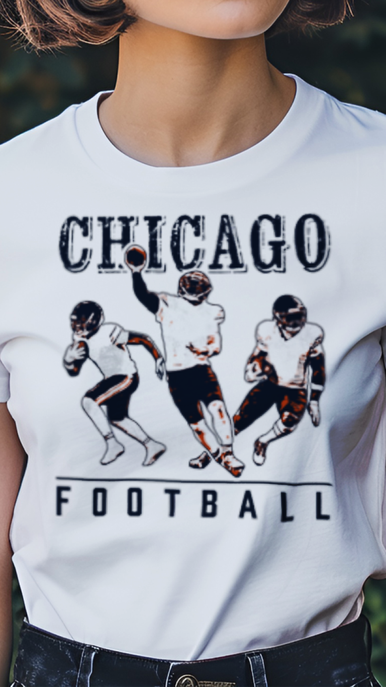 Person wearing a white t-shirt with 'Chicago Football' graphic design outdoors.