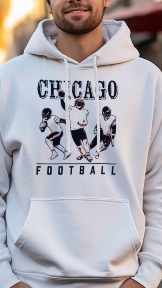 Man wearing a white hoodie with 'Chicago Football' graphic on a street background