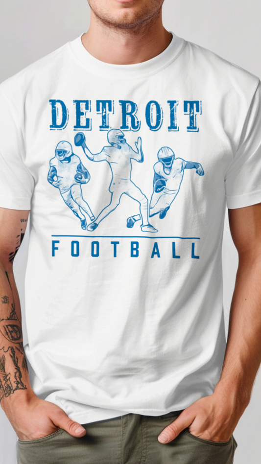 Person wearing a white t-shirt with 'Detroit Football' design on a plain background