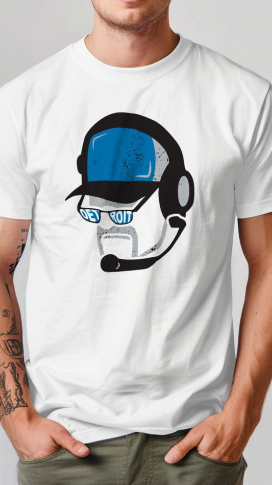 Person wearing a white t-shirt with a graphic design on a plain background