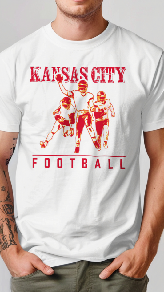 Person wearing a white t-shirt with 'Kansas City Football' graphic design on a plain background