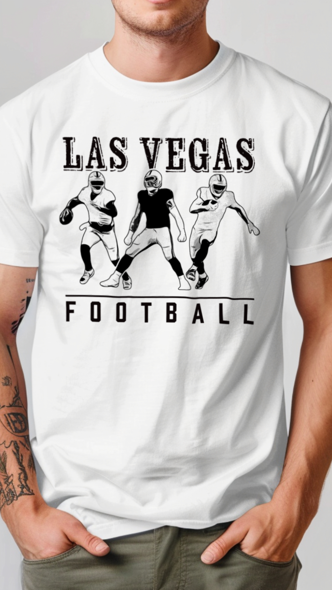White t-shirt with 'Las Vegas Football' design featuring three football players on a plain background