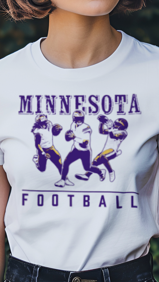 Person wearing a white t-shirt with 'Minnesota Football' design outdoors.