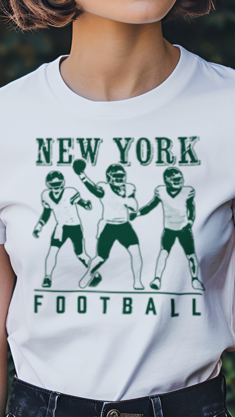 Person wearing a white t-shirt with 'New York Football' graphic in a garden setting