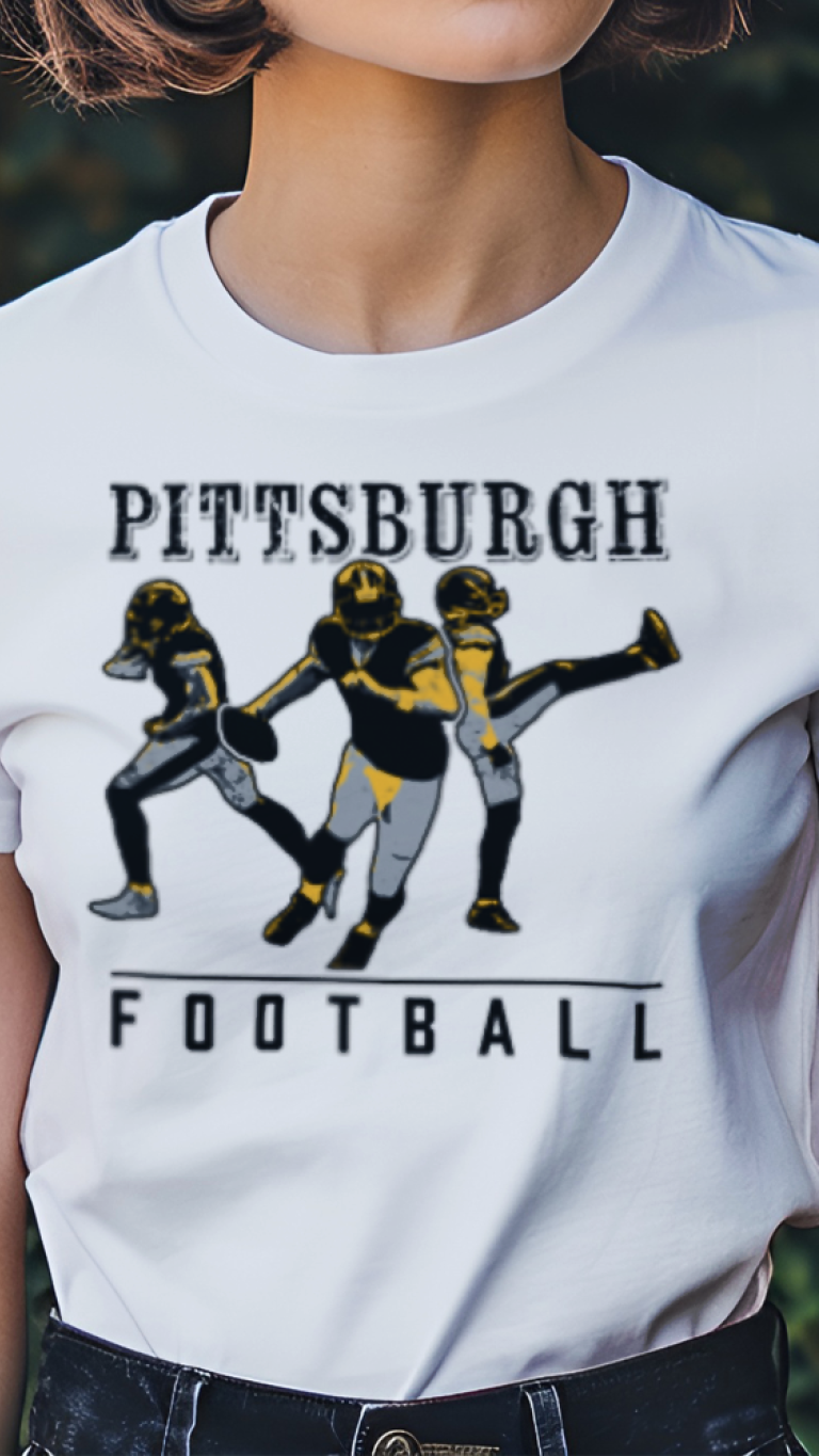 Person wearing a white t-shirt with 'Pittsburgh Football' graphic in a garden setting