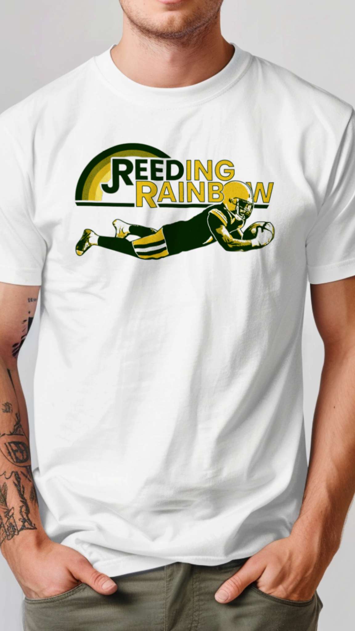 Person wearing a white t-shirt with a graphic design and text on a plain background