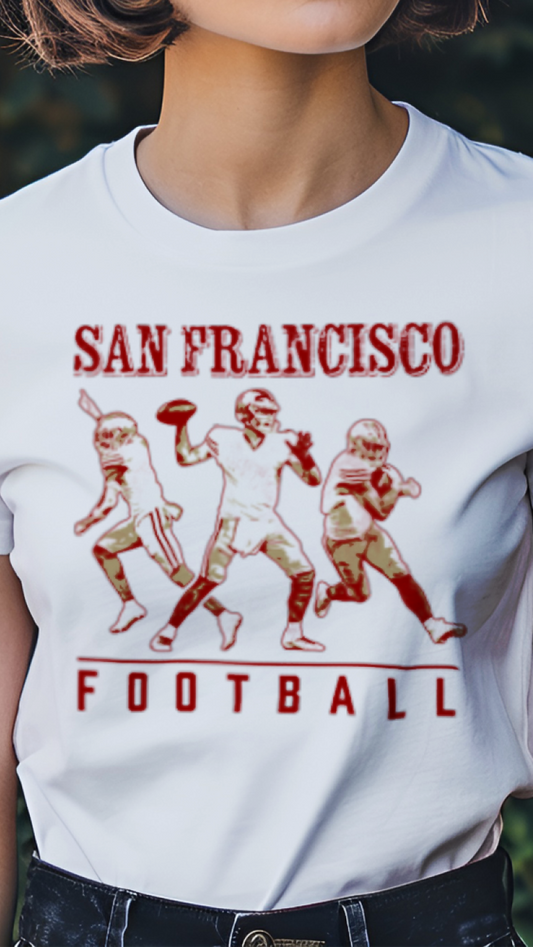 Person wearing a white t-shirt with 'San Francisco Football' graphic design outdoors.