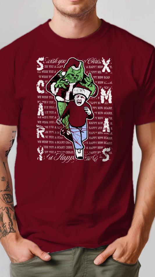 Maroon t-shirt with Christmas-themed graphic and text worn by a person on a plain background