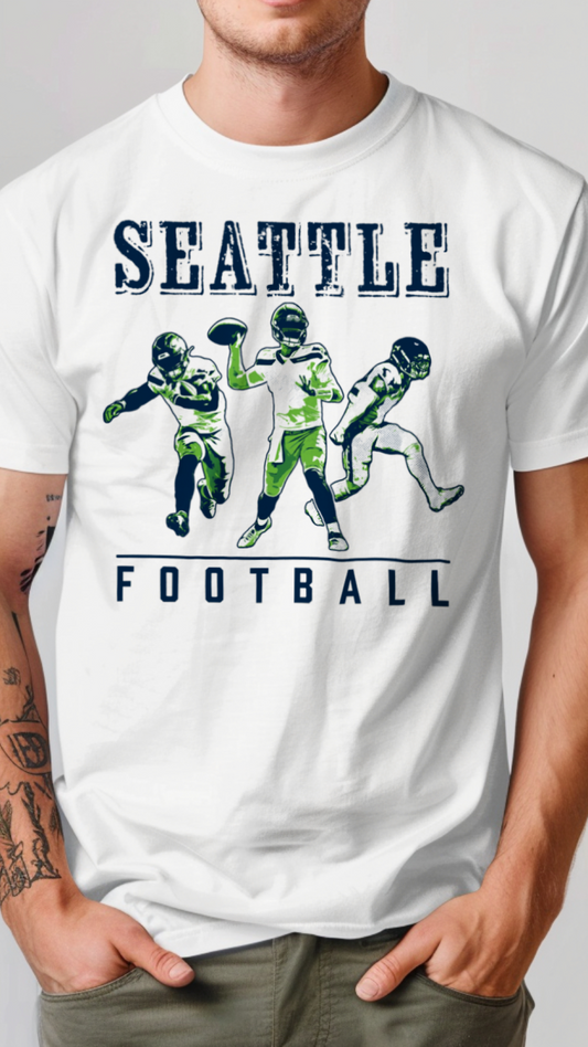 White t-shirt with Seattle football graphics and text on a plain background