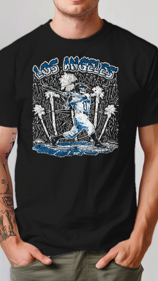 Person wearing a black t-shirt with a graphic design of a person playing baseball in Los Angeles.