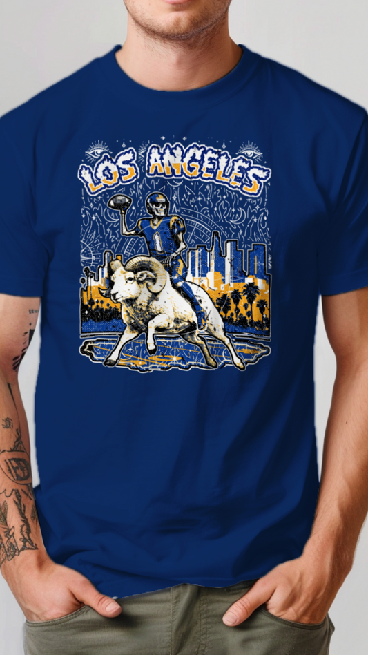 Person wearing a blue t-shirt with a graphic design of a ram and cityscape, with 'Los Angeles' text.