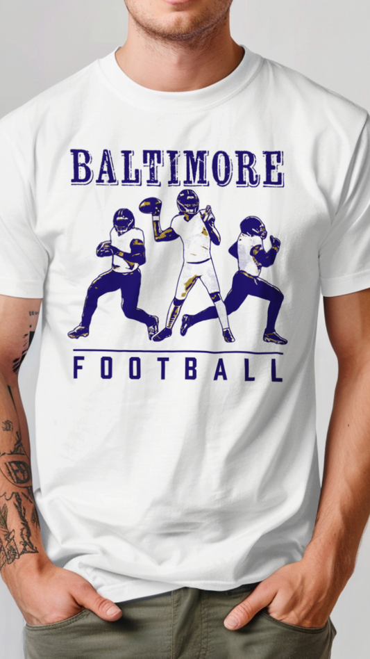 White t-shirt with 'Baltimore Football' graphic featuring three football players on a plain background