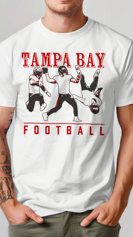 White t-shirt with 'Tampa Bay Football' graphic featuring football players on a gray background