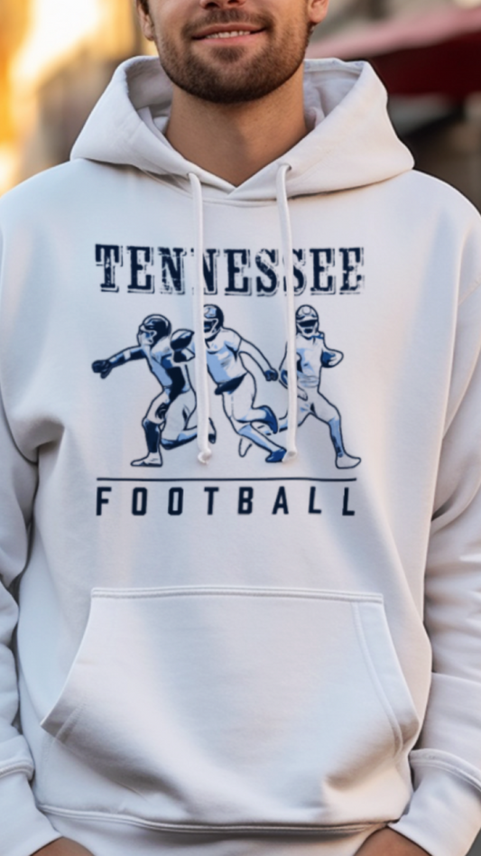 Man wearing a white hoodie with 'Tennessee Football' text and graphics on a street background